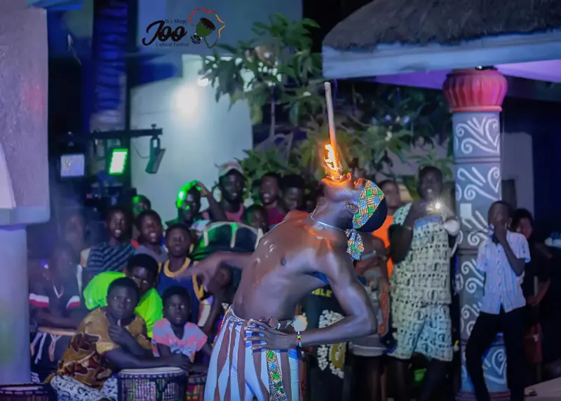 African Beat drummers performing on a night stage with coloured lights in Melbourne