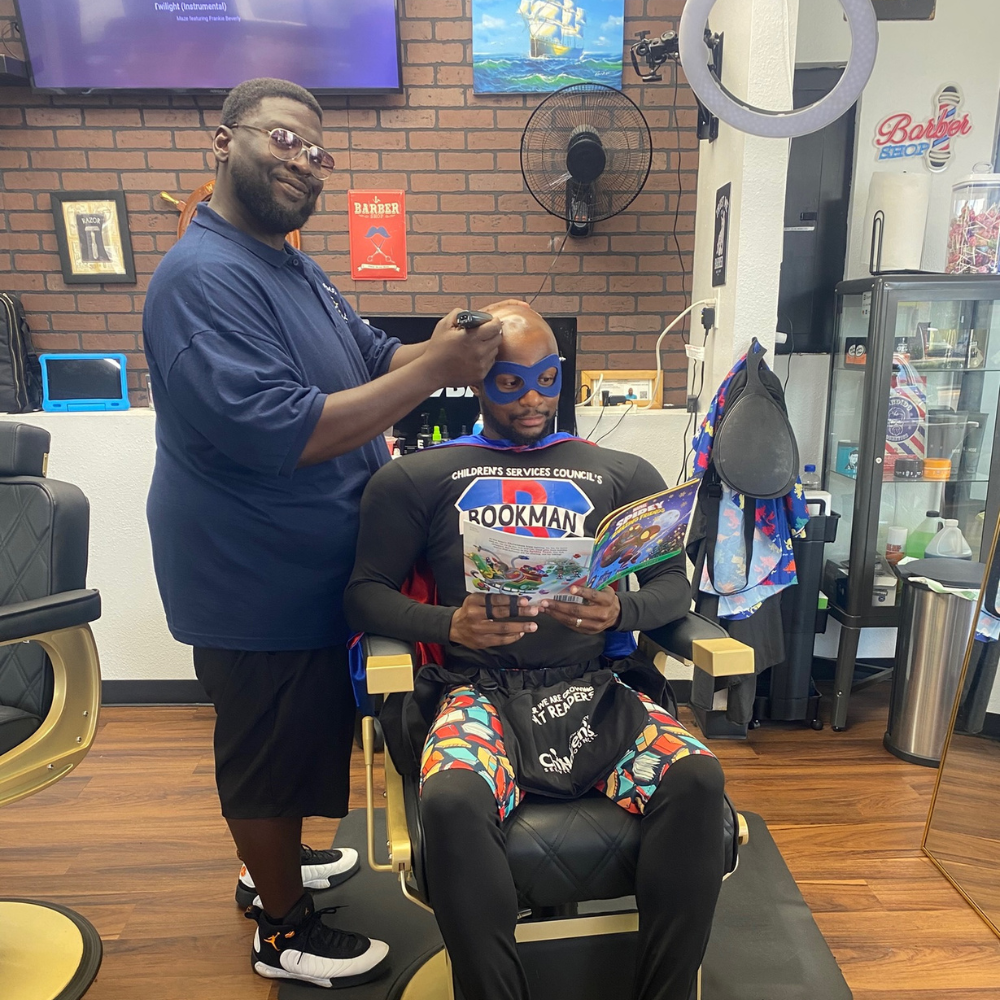 TCBU volunteer barbers giving back