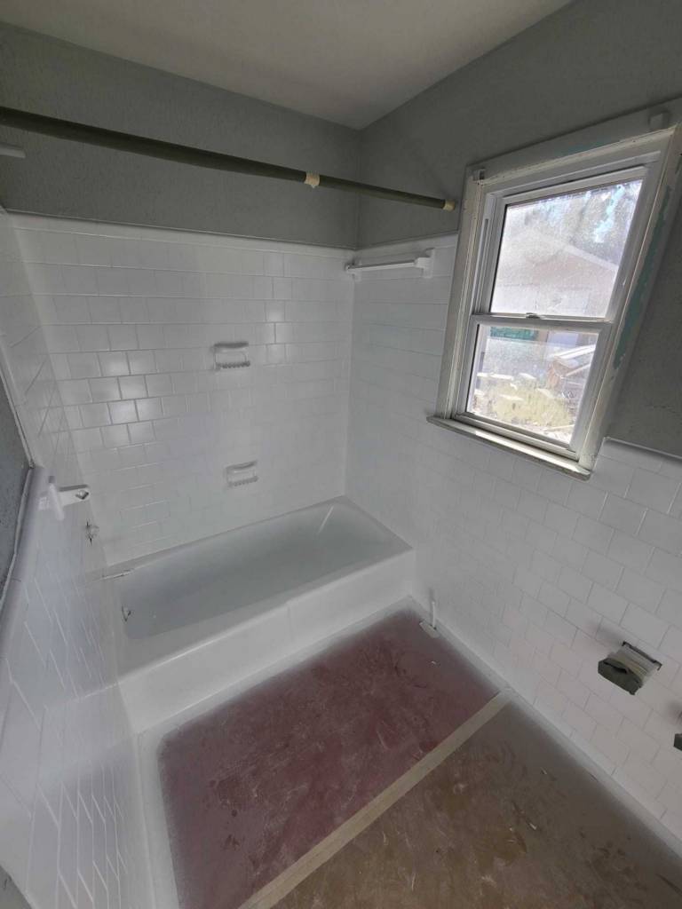 Bathtub and surrounding tile being refinished in Tuckahoe