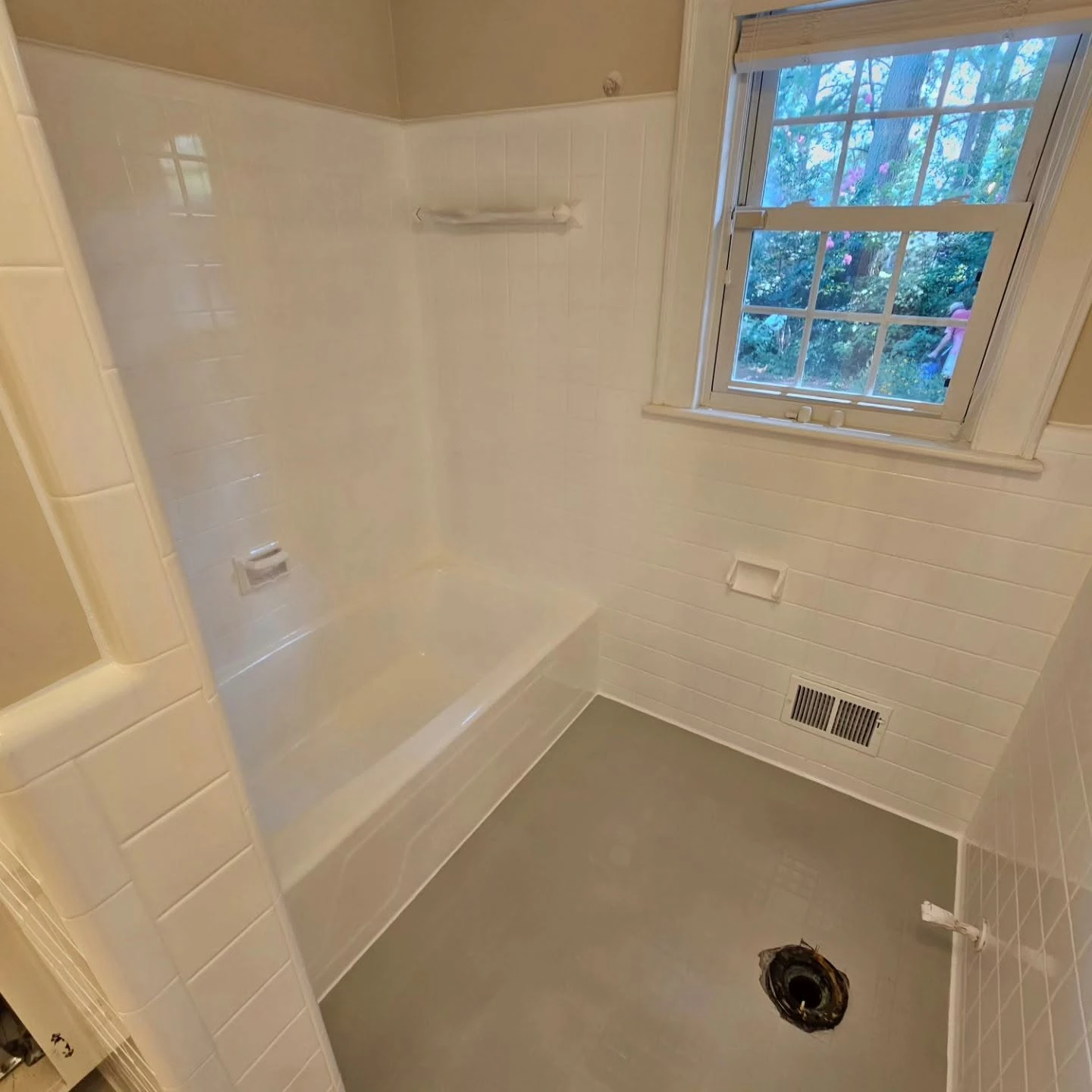 Acrylic bathtub being evaluated for professional refinishing