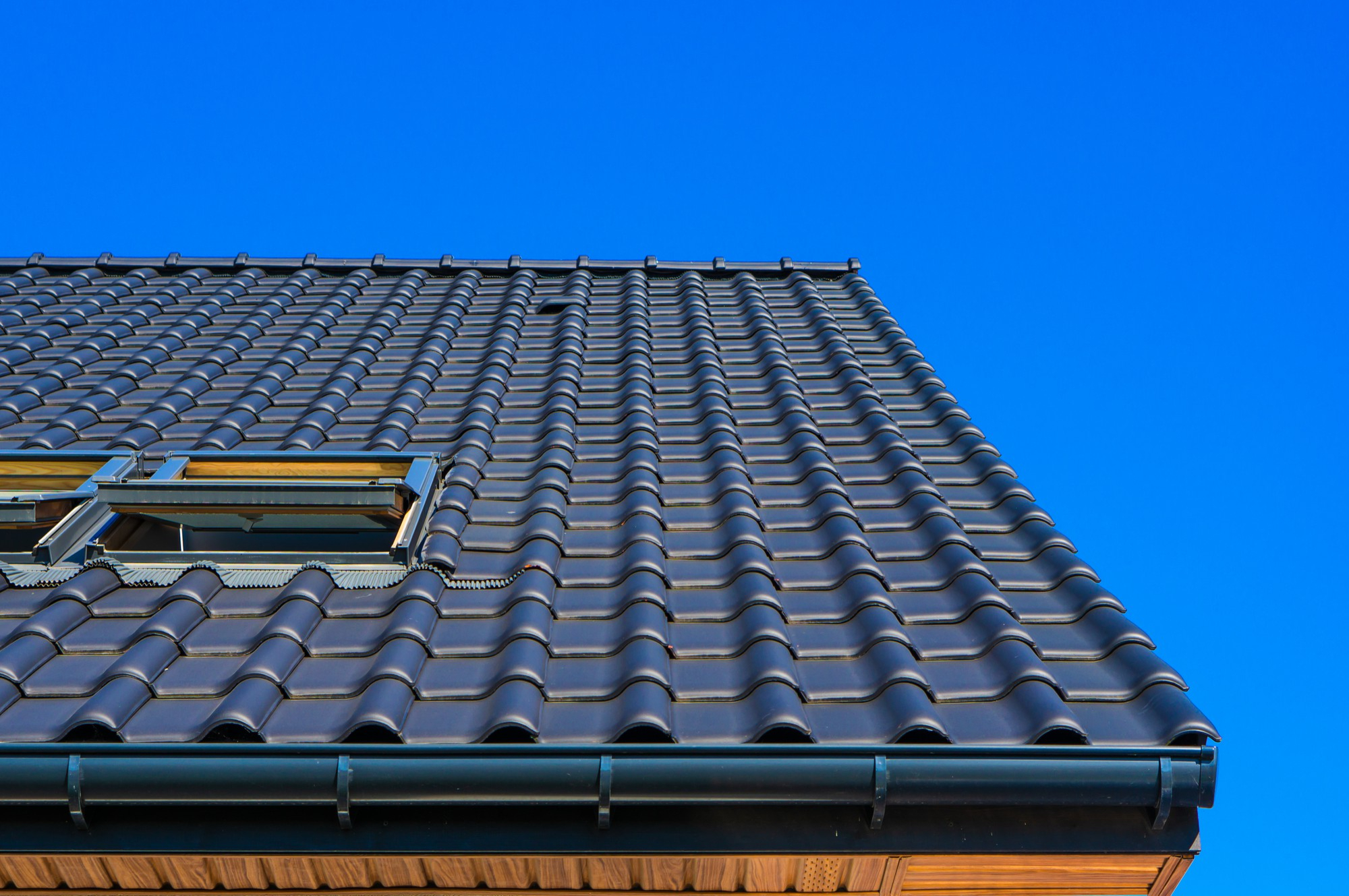 Roofing crew installing shingles