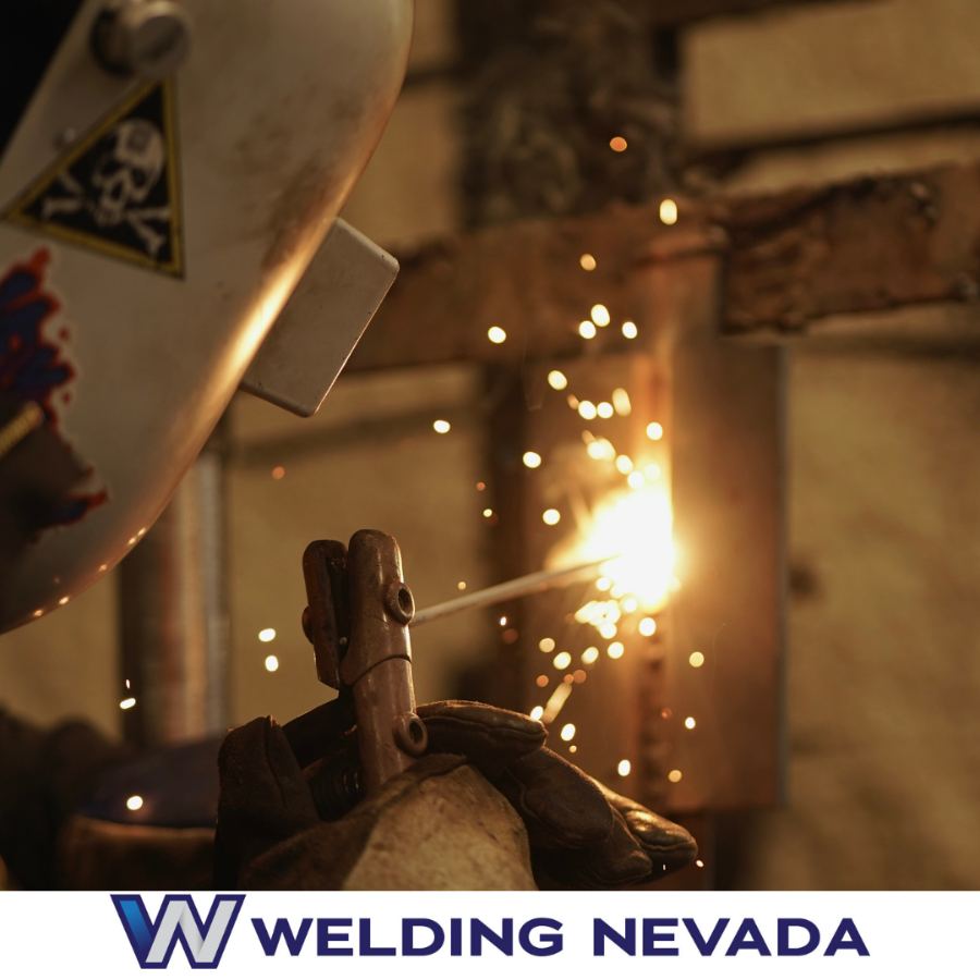 Welder striking an arc with sparks flying