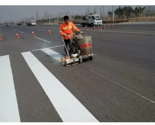 MDW Tar road construction team operating paving machinery