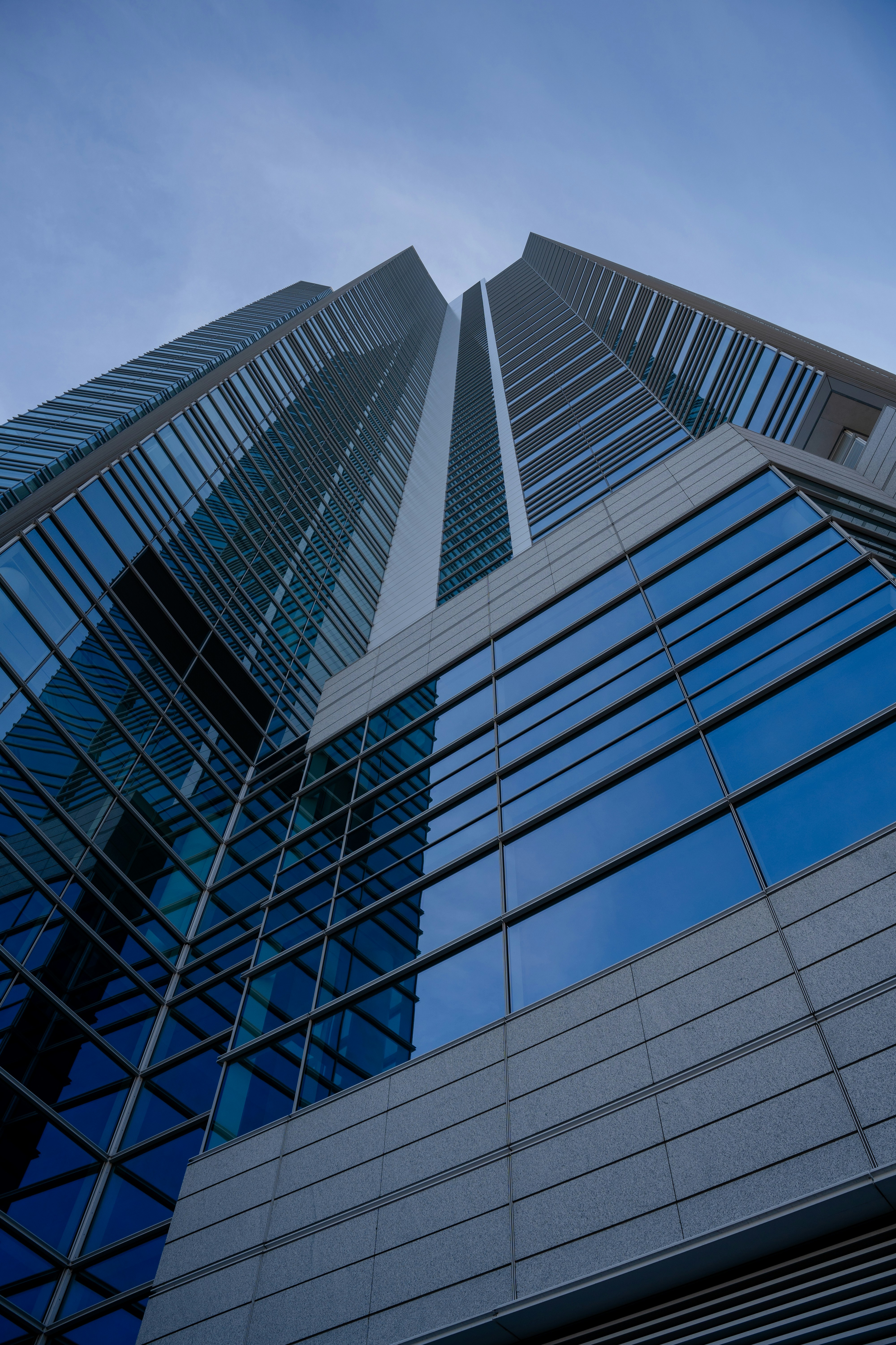 Blue-glass skyscrapers viewed from below