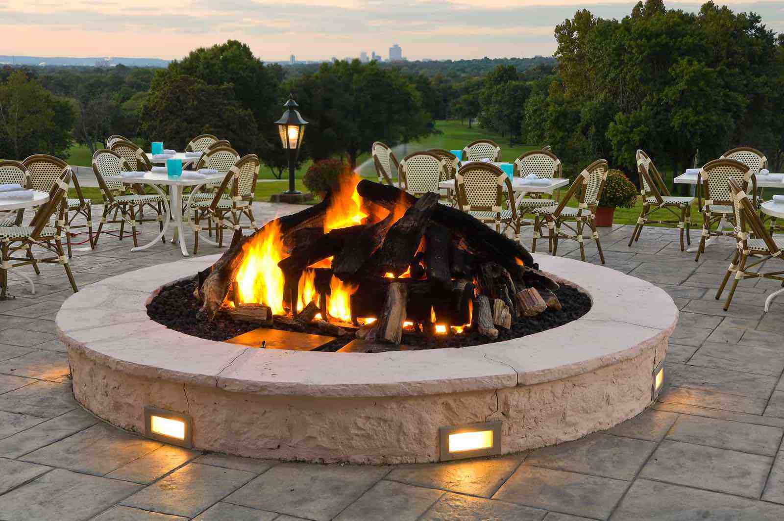 Illuminated water feature and hardscape lighting at dusk