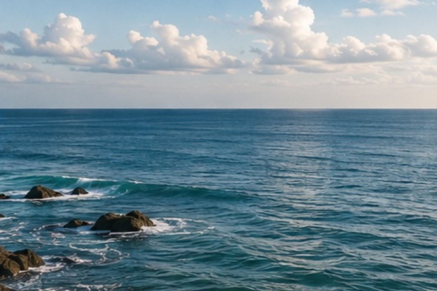 Ocean waves breaking against a rocky coastline