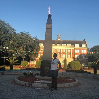 Rafat on the FAMU campus beside the Eternal Flame monument
