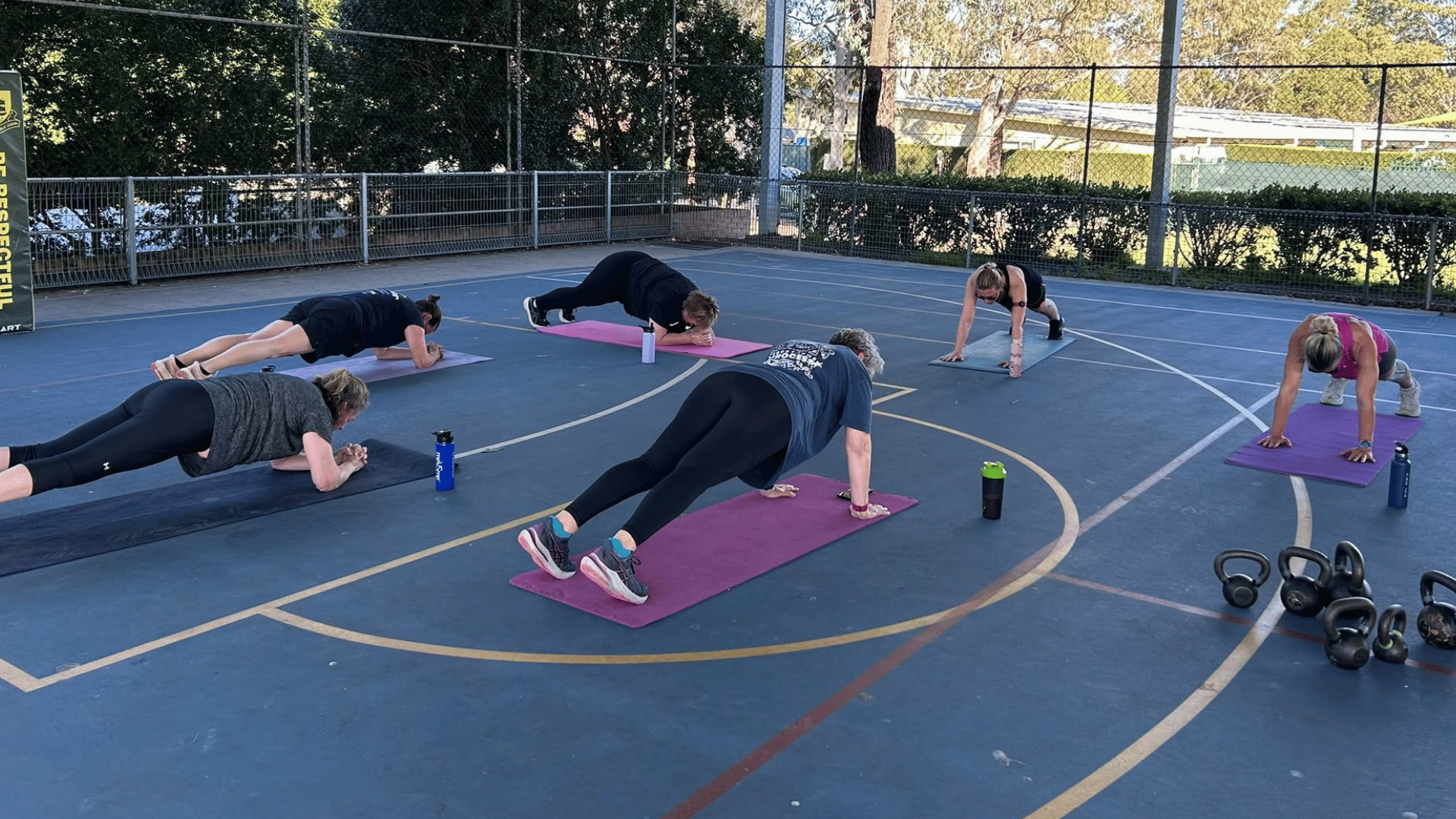 Women doing a group fitness workout outdoors during perimenopause Women doing a group fitness workout outdoors during perimenopause
