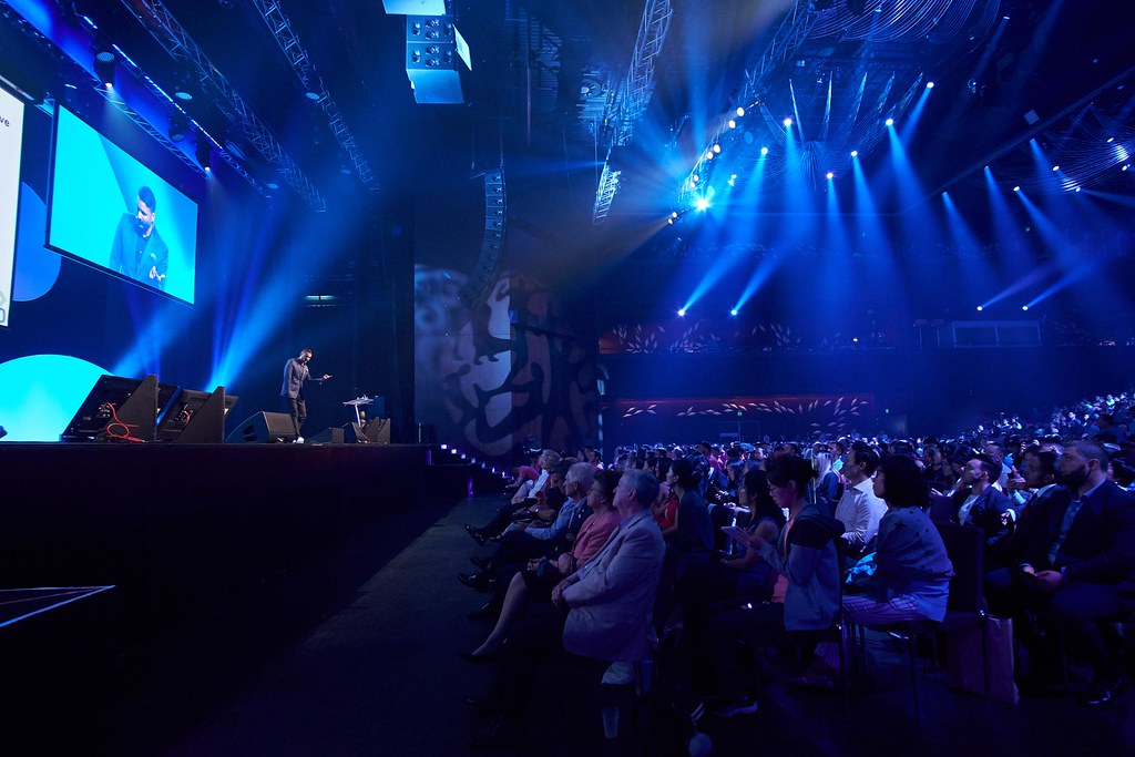 Sam Cawthorn addressing a large international audience