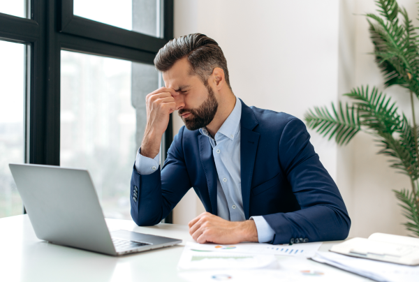frustrated business man looking at computer without any website traffic frustrated business man looking at computer without any website traffic