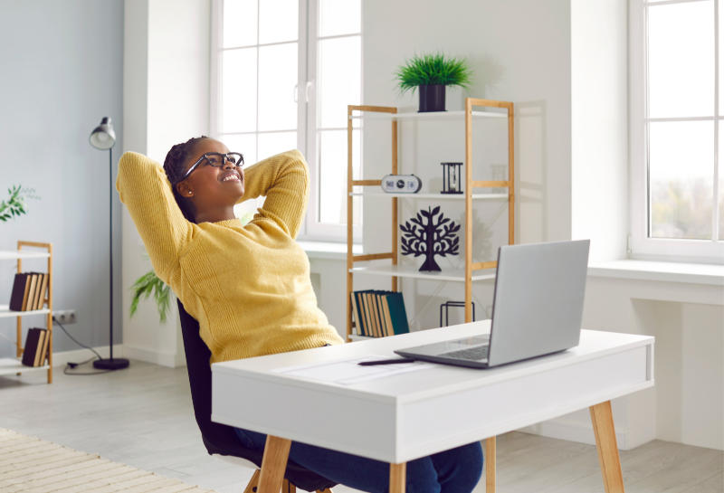 Small business owner relaxing after automating customer inquiries and lead response.