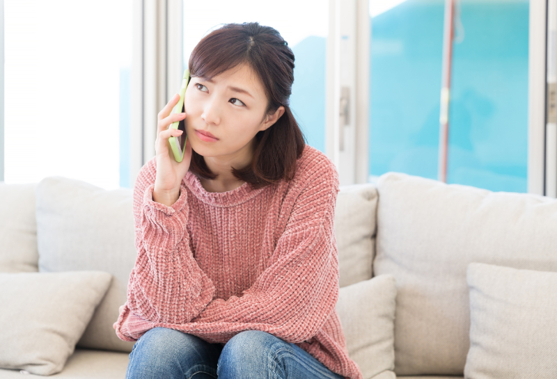 woman waiting on phone for someone to pick up