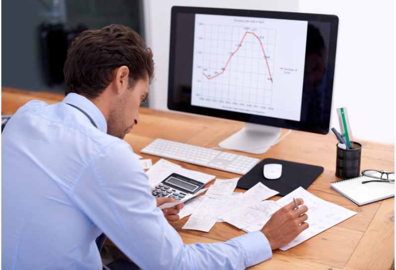 Business owner analyzing response time data and lead conversion metrics to identify gaps in customer response speed.