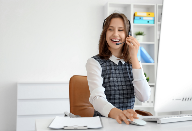 Professional customer support agent using headset and computer, illustrating fast lead response and high-converting customer service.