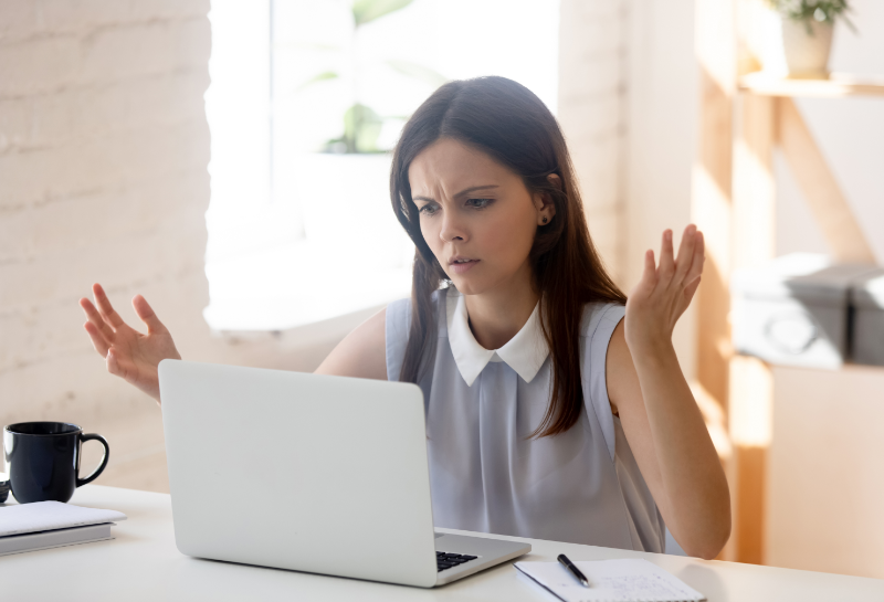 frustrated business owner looking at computer with no online traffic coming into business website frustrated business owner looking at computer with no online traffic coming into business website