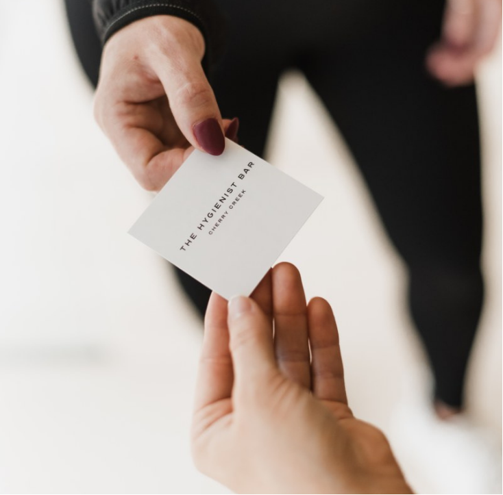 a couple of people standing in front of a counter