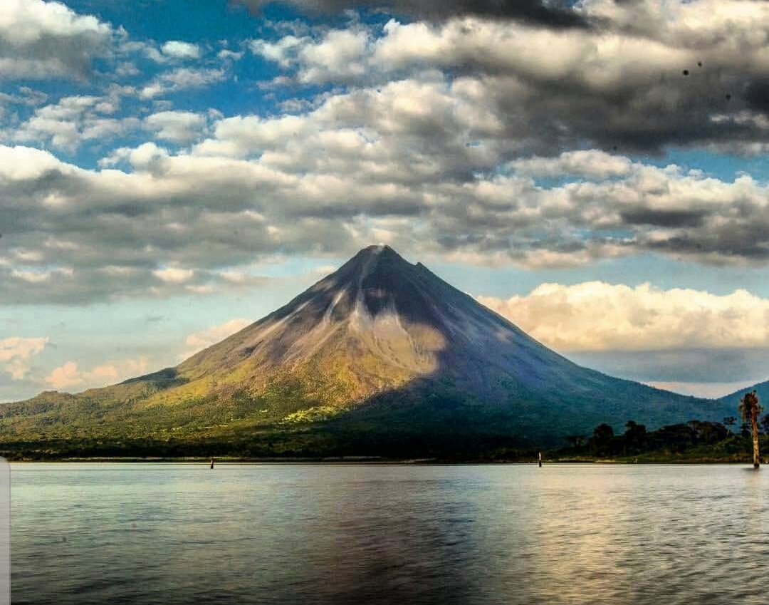 Arenal Volcano rising beyond the lake