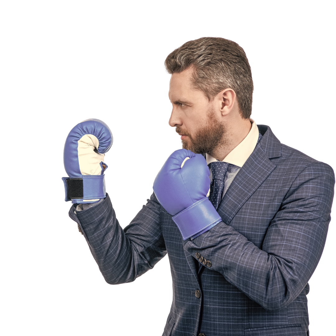 business man in suit wearing boxing gloves