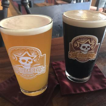 two pints of ales from los muertos brewing. 