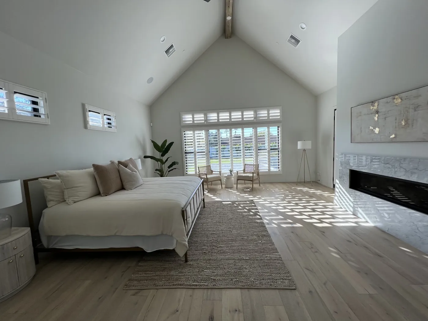 After: bedroom with wide-plank flooring