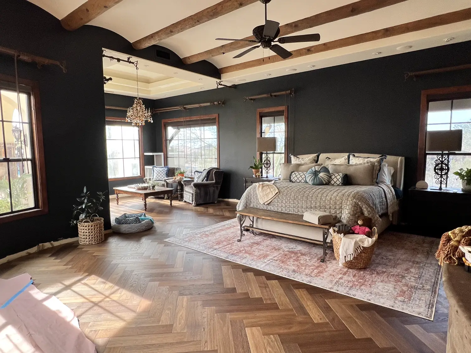 Herringbone wood floor in a primary suite
