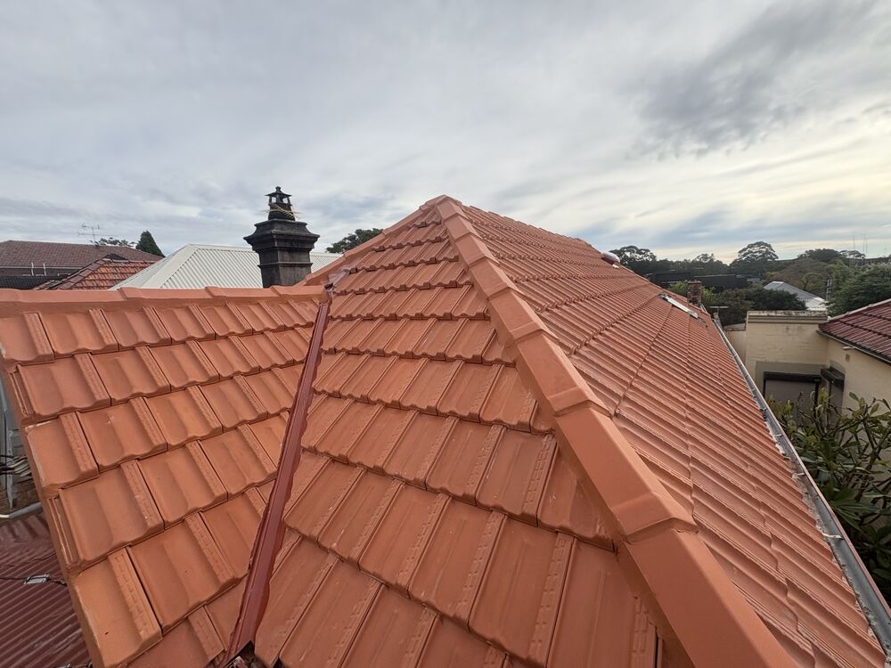 Completed terracotta tiled re-roof by Protex Roofing Solutions