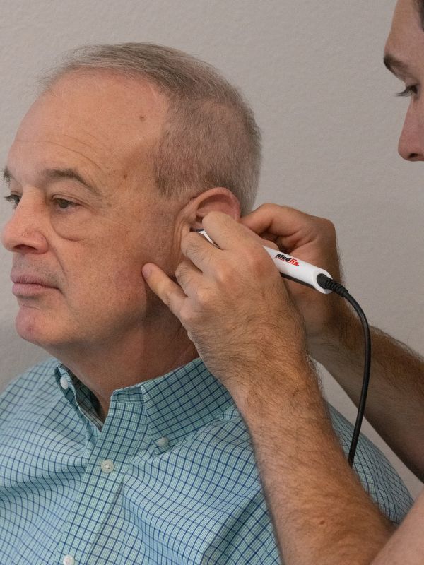 patient having his ear checked