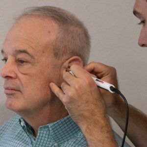 patient having his ear checked