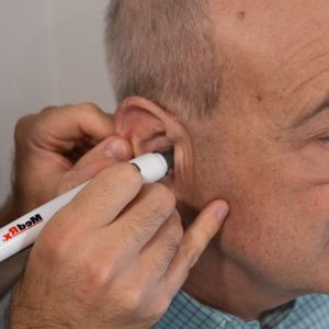 patient having his ear checked