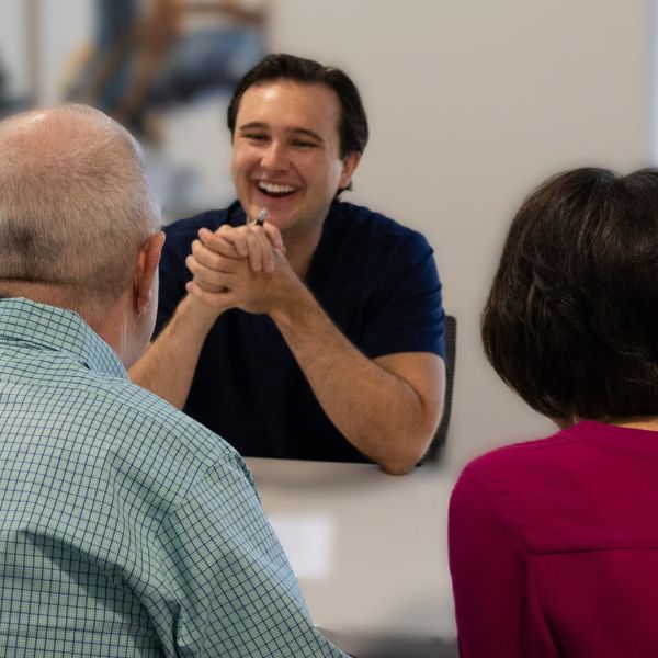 hearing specialist meeting with patients 