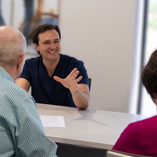 hearing specialist meeting with patients 