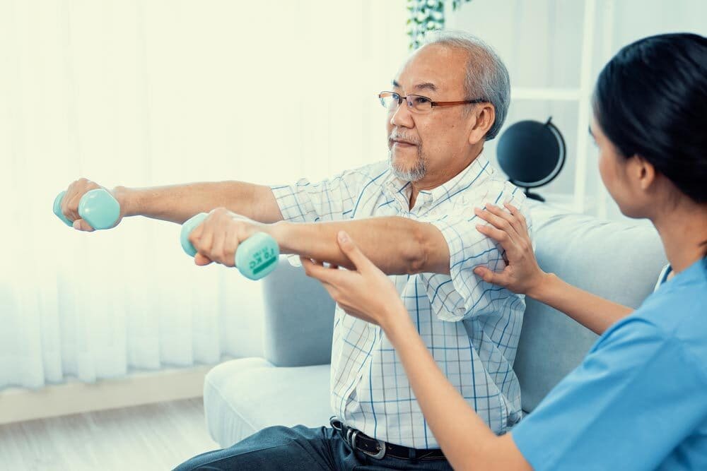 Patient doing a guided rehabilitation exercise at a Hamilton physiotherapy clinic