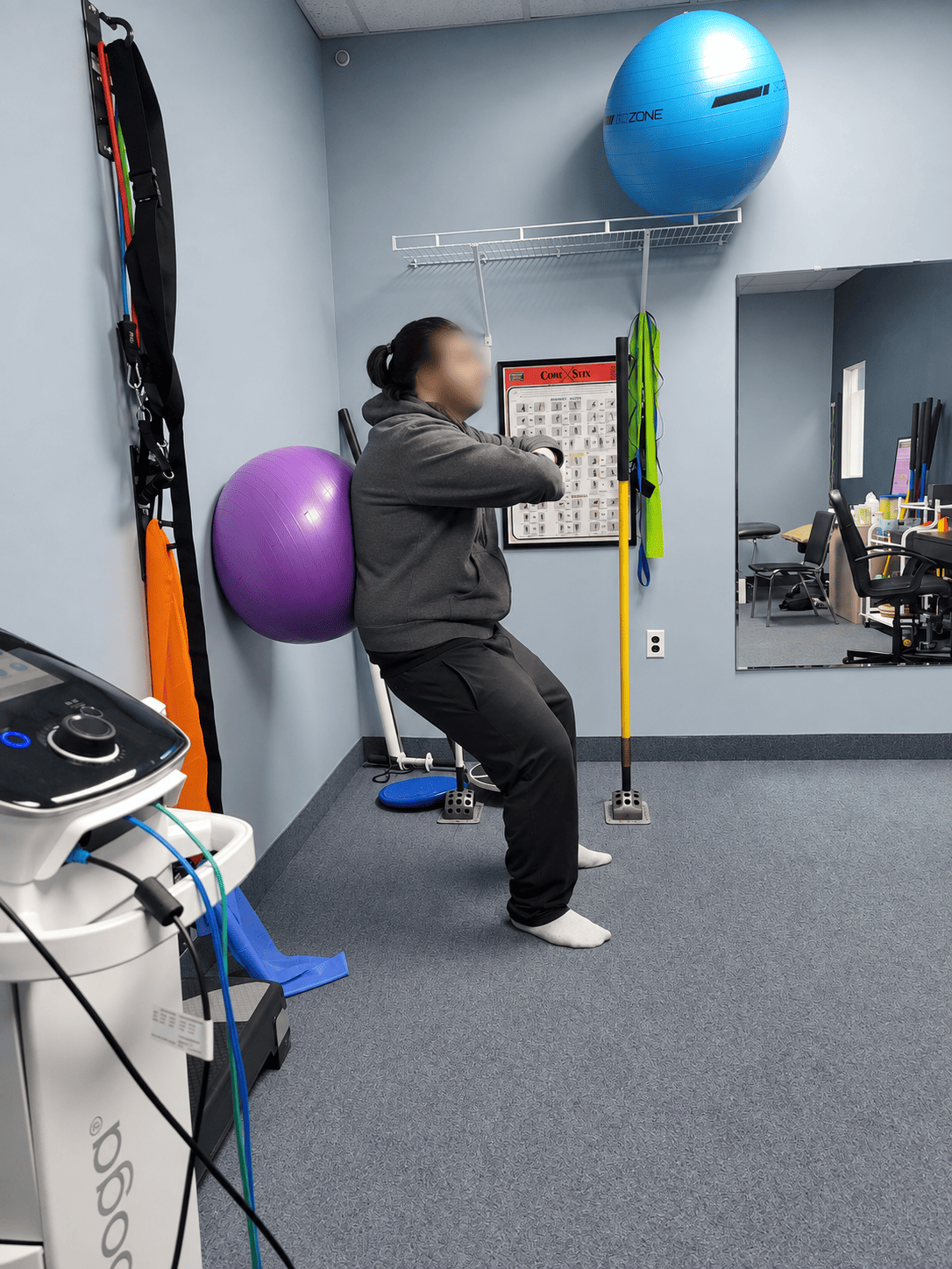 Physiotherapist assessing a patient with back pain at Medhealth Physiotherapy in Hamilton