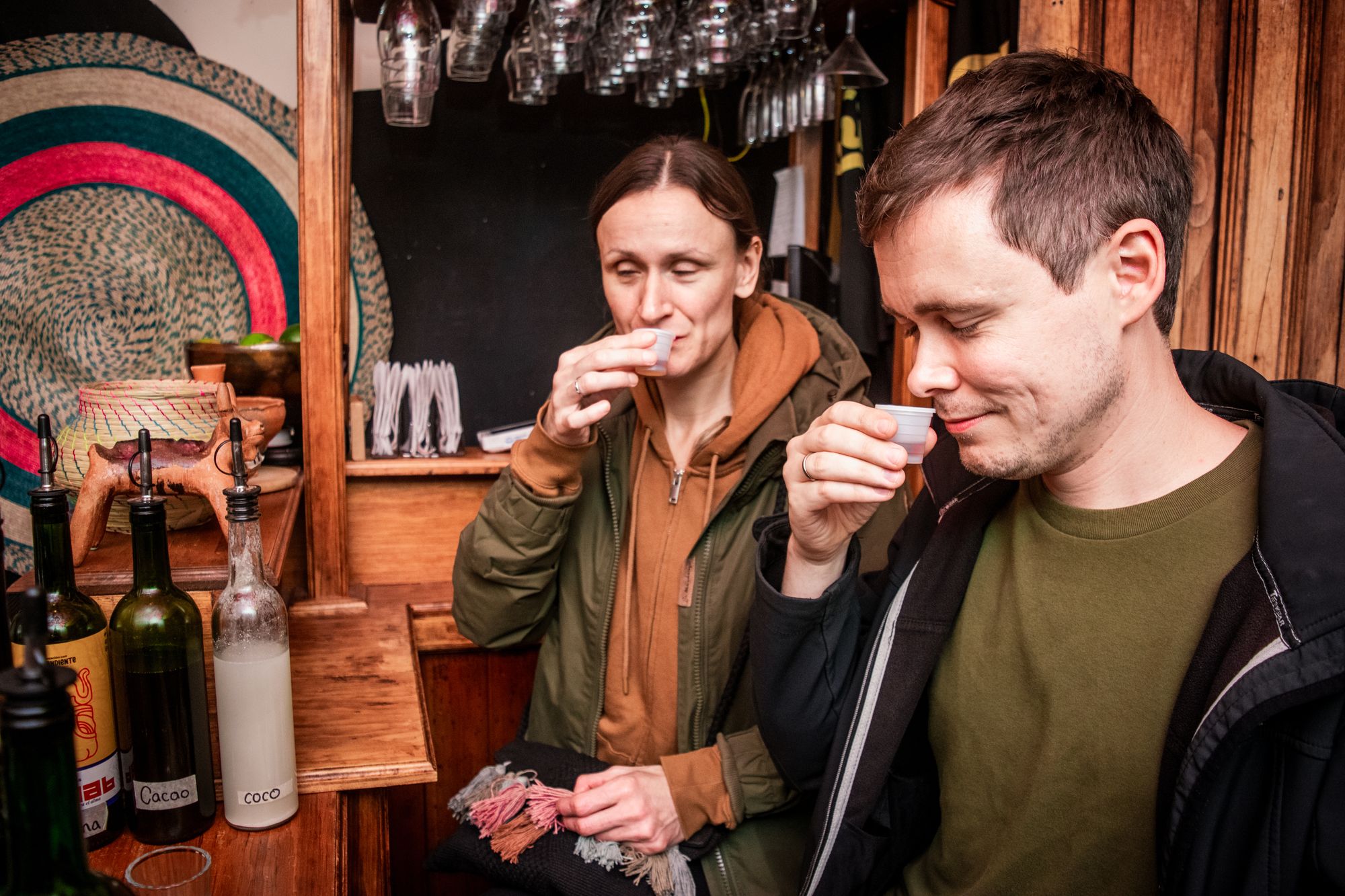 Guests tasting pox at the bar at La Independiente