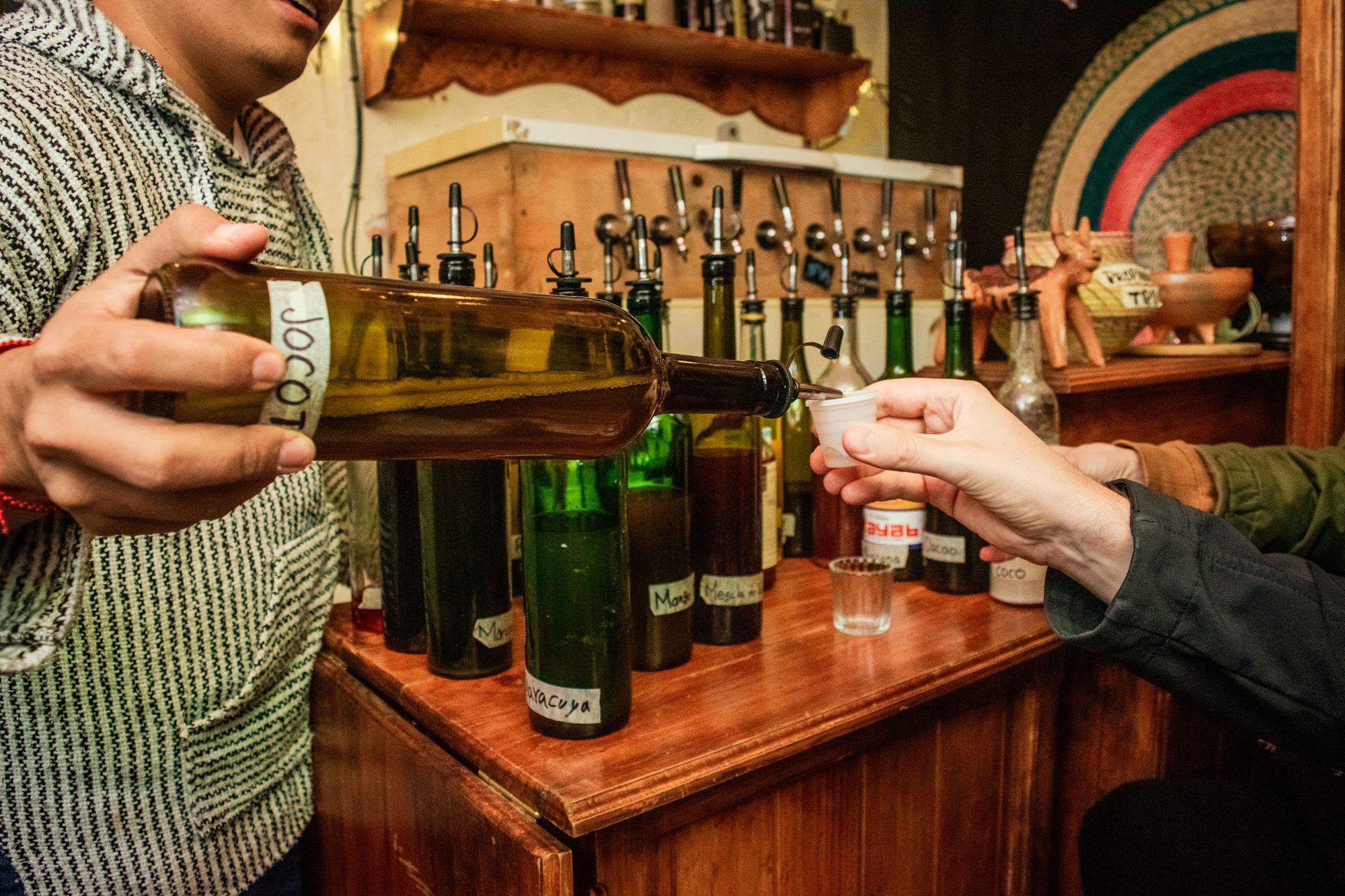 Pouring pox into tasting cups during a free tasting