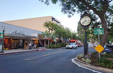 A street view of Montrose, California, with a large clock in the foreground