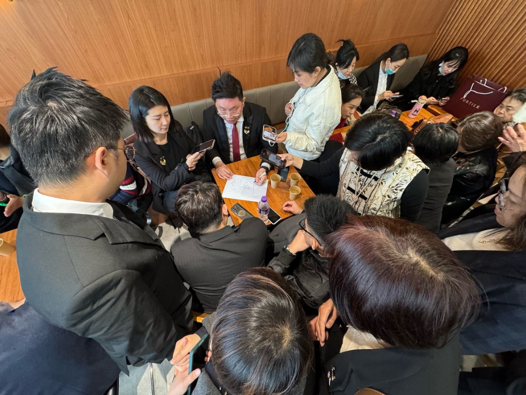 Duncan coaching an intimate group huddle.