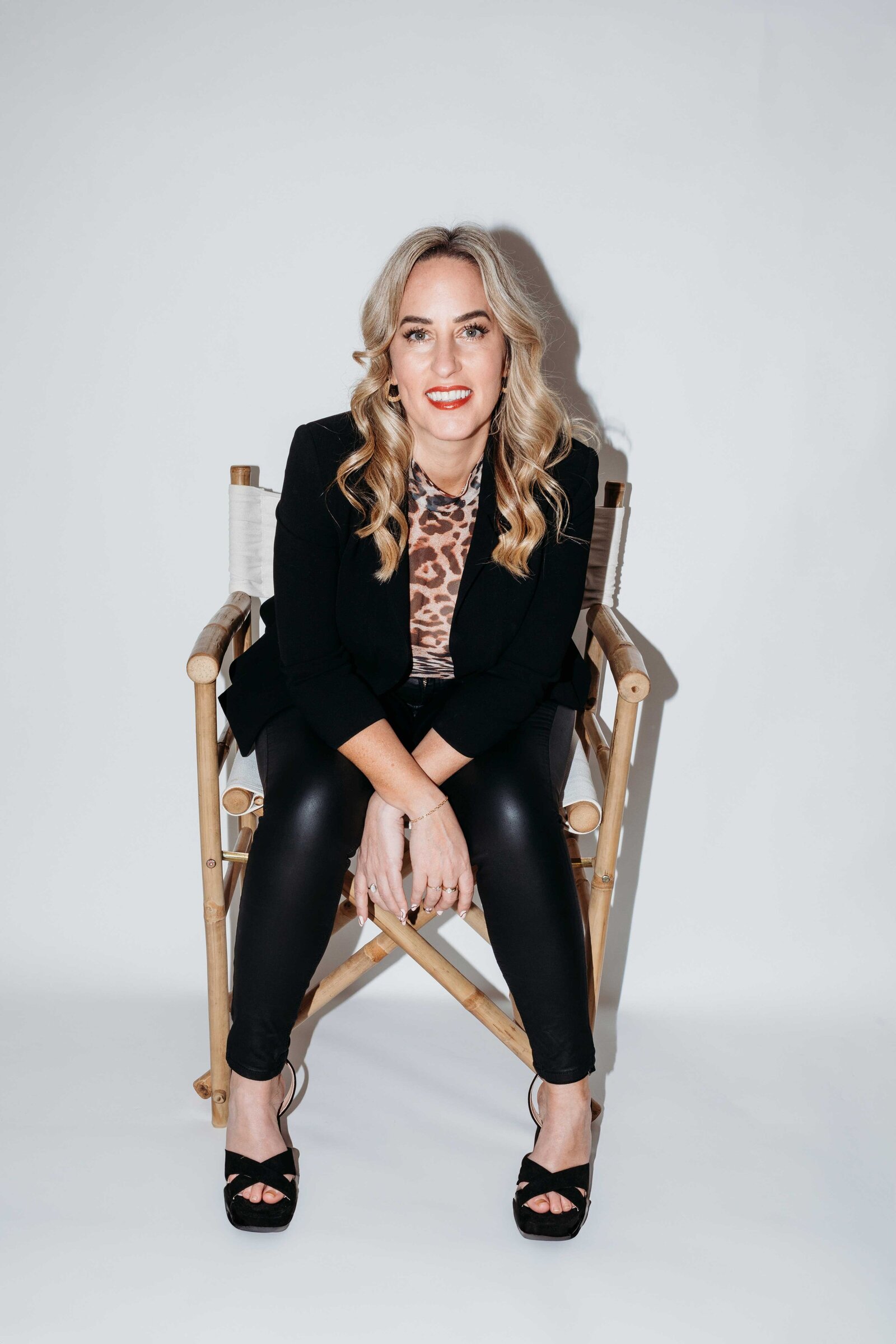 Gemma Heard sitting in a director's chair