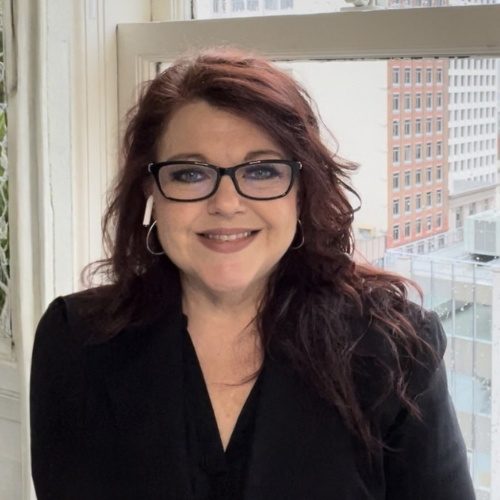 Warm, professional headshot of wedding planner