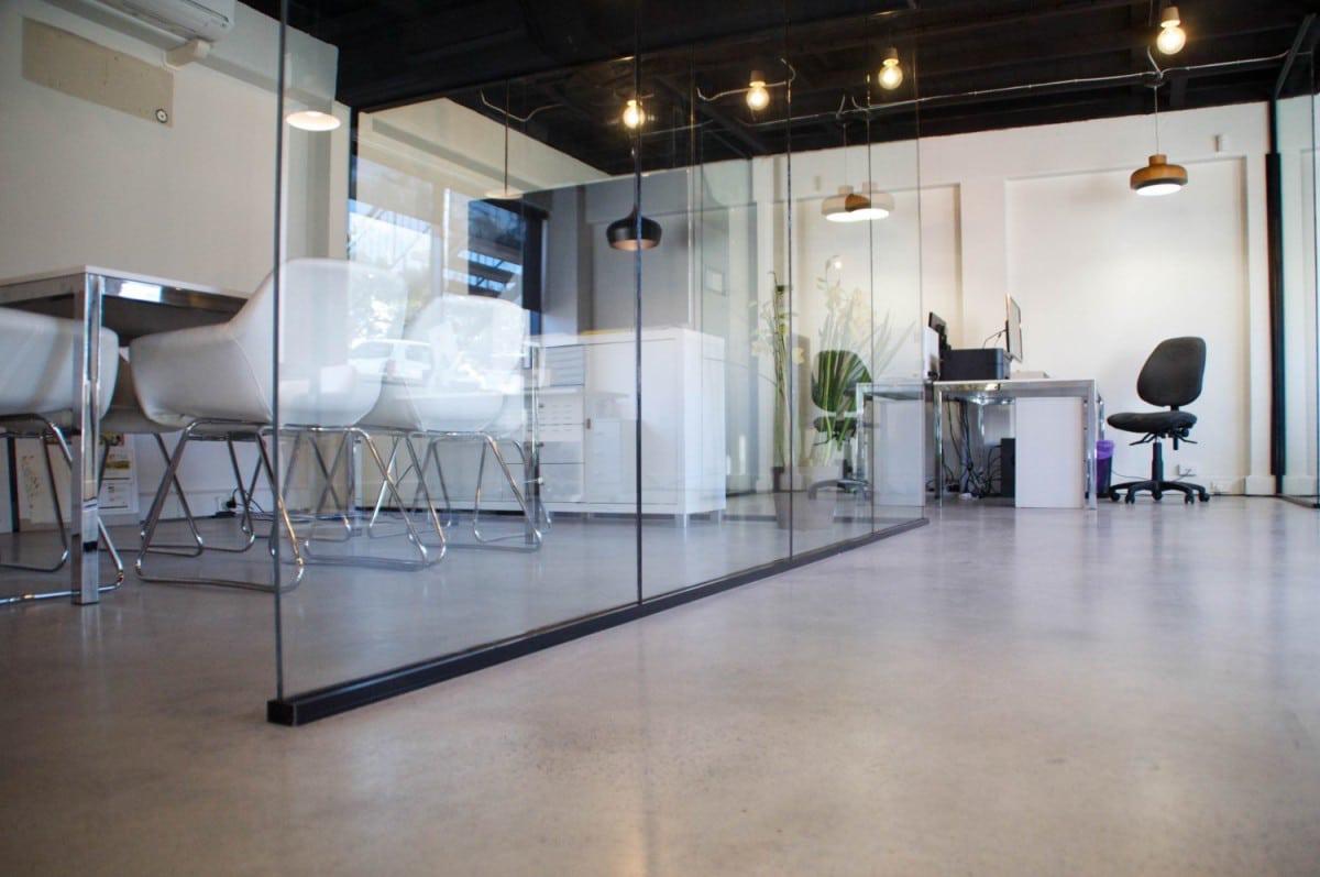 Concrete floor with soft lighting and seating
