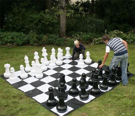 Adults laughing and competing in a Walla Balla game.