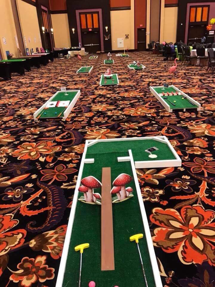 Nine-hole putt-putt game course with custom obstacles.