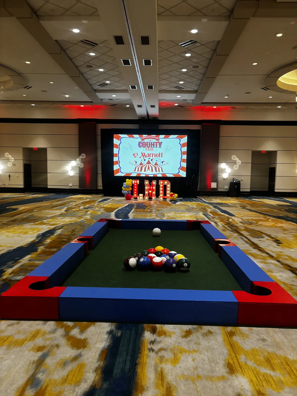 Giant Soccer Pool game with soccer balls on a pool-style playing surface.