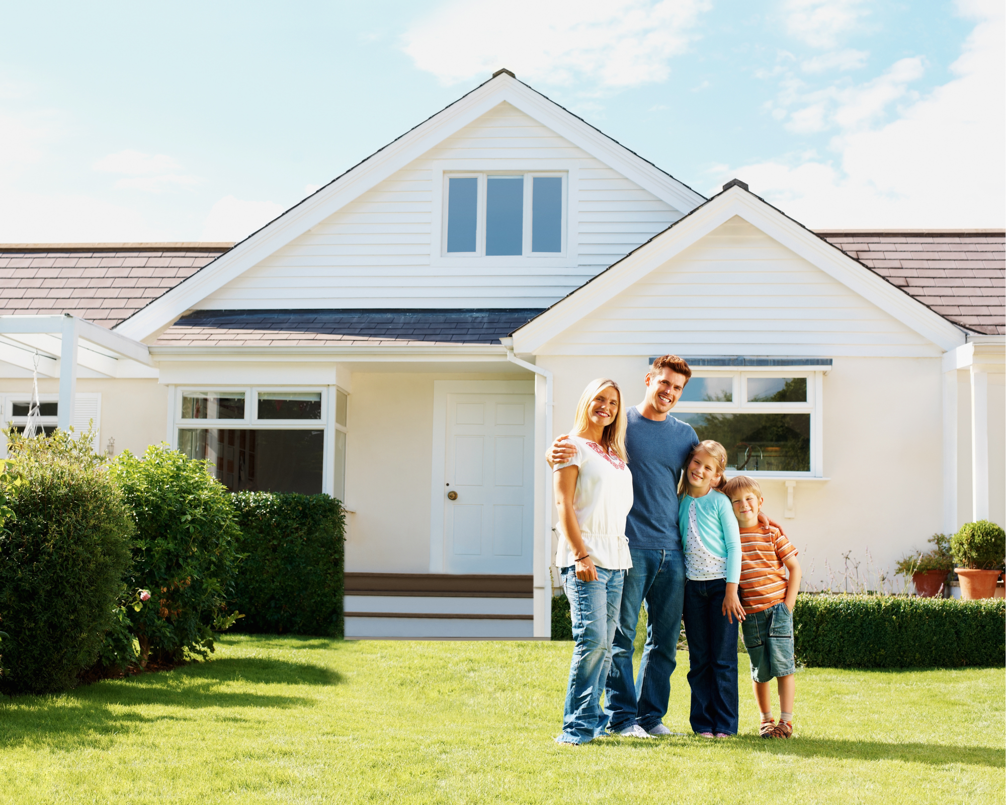 A happy family outside their new home by REDBO