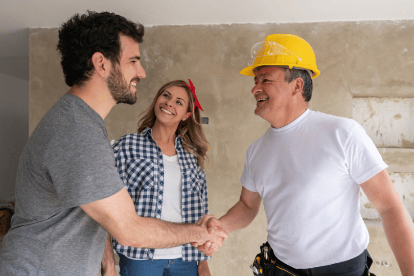 Home owner shaking hand with Real Estate Professional - REDBO