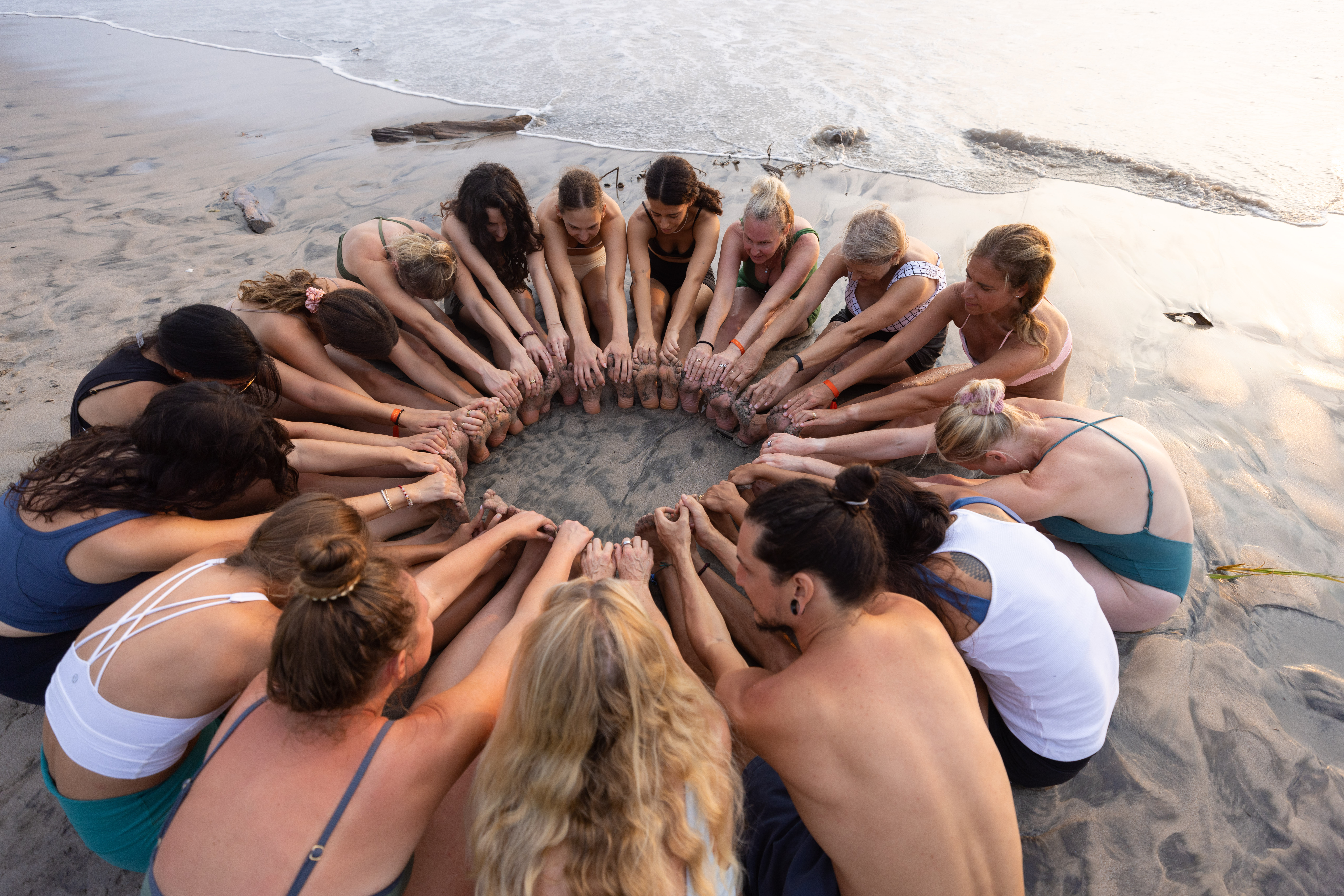 Group yoga on the beach in Nosara