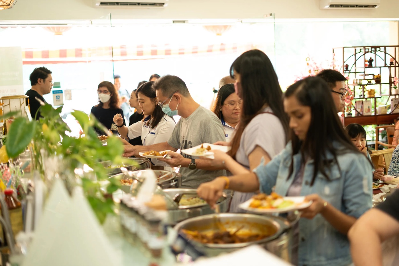 Guests serving themselves at a buffet lunch