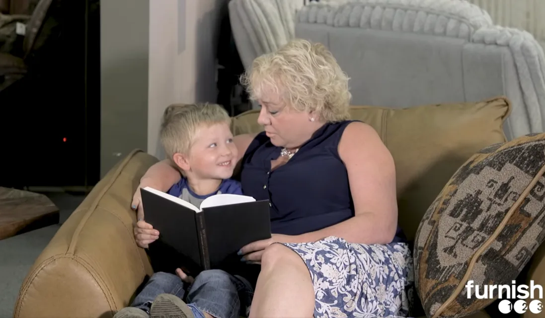 Angie Kuhn, owner of Furnish 123, with her grandson