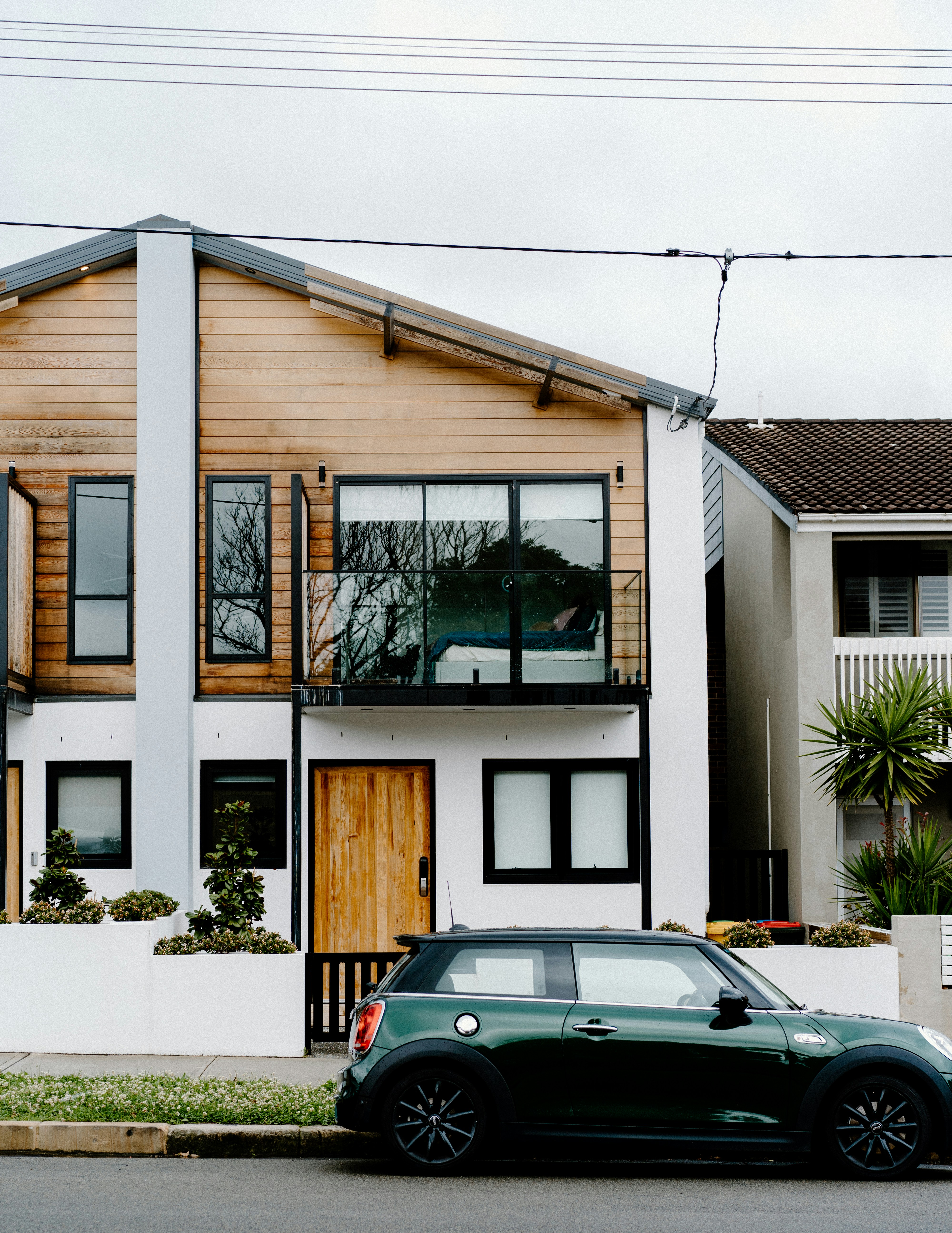 Painter working on exterior window trim during a whole-home repaint in Melbourne