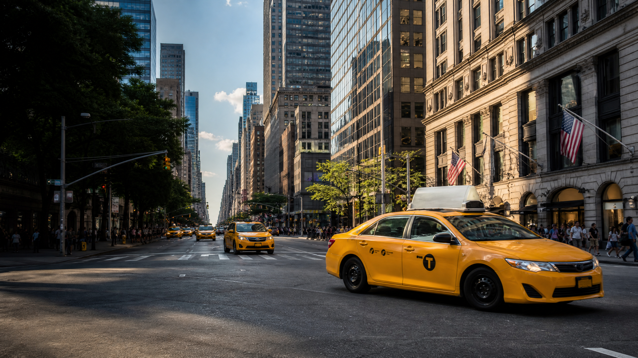 Busy city street with multiple yellow taxi cabs